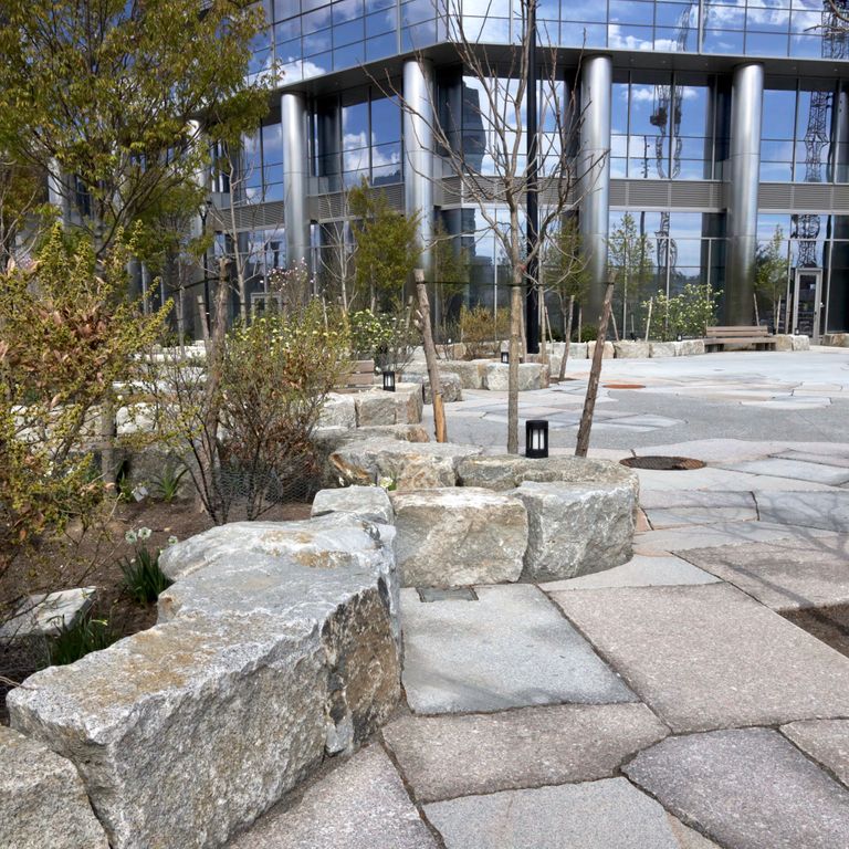 The image shows this material being used in a patio pavers application.