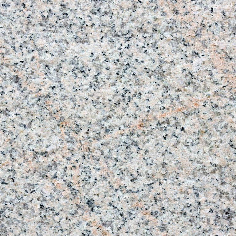 Color/Finish variation image for Granite - Millenium. The surface finish shown is flamed. The dominant color shown is gray; with beige, blue, pink and cream secondaries. Veined, speckled and coarse speckled color patterns.