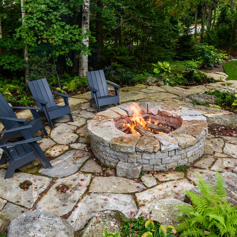 The image shows this material being used in a patio pavers application. Dominant colors shown are beige and gray; with an orange/rust secondary. Random color pattern.
