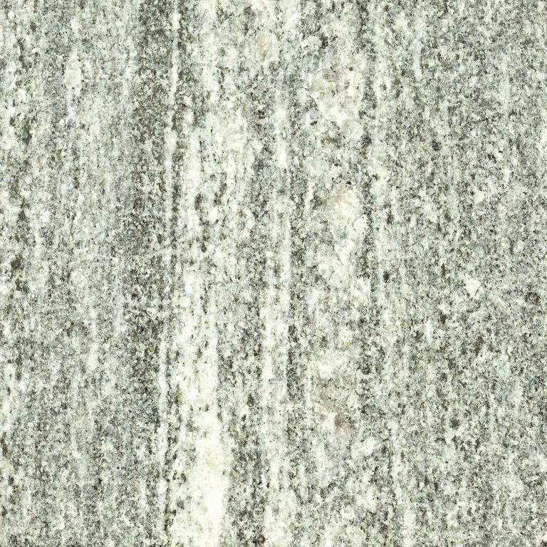 Feature image for Galactic Granite. Dominant colors shown are beige, gray, white and cream; with a green secondary. The color mix creates a warm feeling. Speckled, coarse speckled and linear color patterns.
