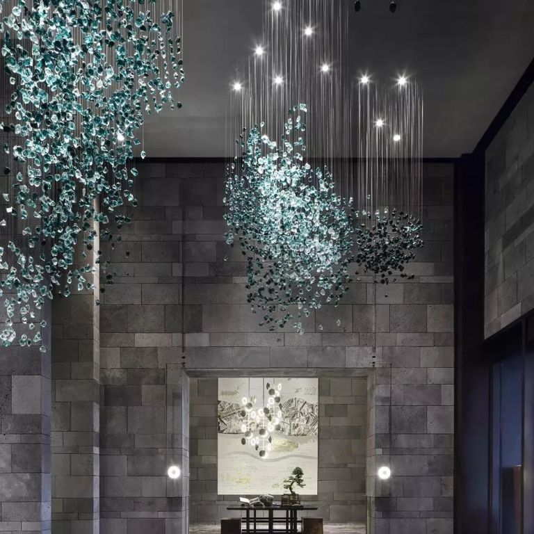 Application image for Basalt - Ankar Lava. The image shows this material being used for full bed veneer and interior cladding. Dominant colors shown are black and gray. The color mix creates a cool feeling.
