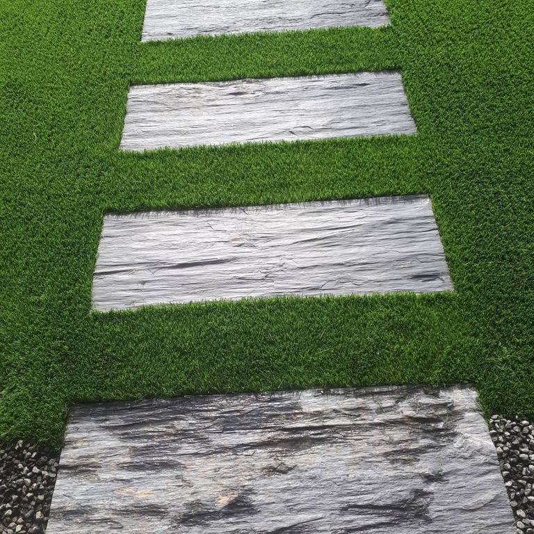 The image shows this material being used in a path pavers application.