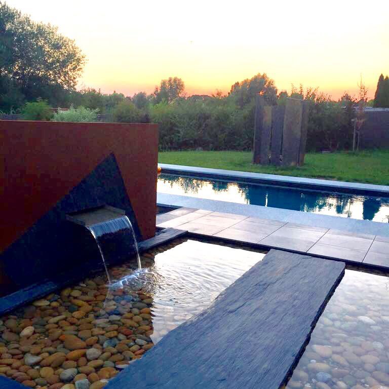 The image shows this material being used for path pavers and patio pavers.