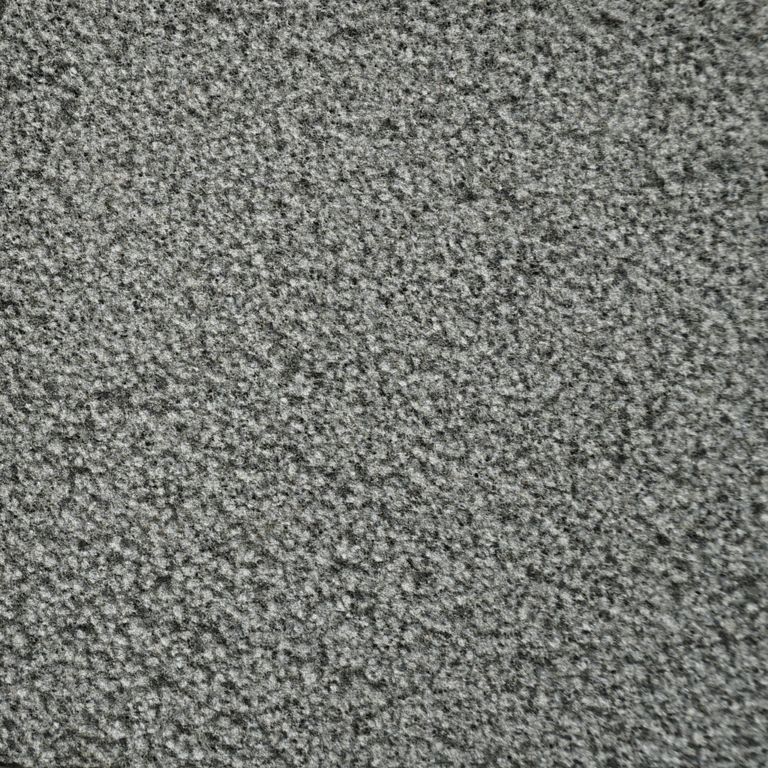 Color/Finish variation image for Ankar Gray Basalt. The surface finish shown is bush hammered. The dominant color shown is gray; with black, brown and green secondaries. The color mix creates a cool feeling. Speckled and coarse speckled color patterns.