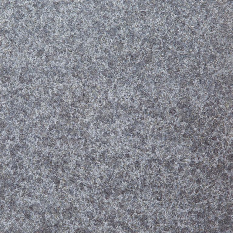 Color/Finish variation image for Granite - Zen Black. The surface finish shown is flamed. The dominant color shown is gray; with blue, green and purple secondaries. The color mix creates a cool feeling. Coarse speckled color pattern.