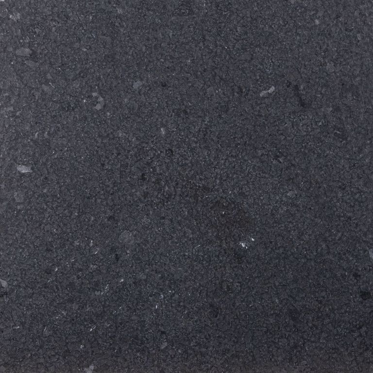 Color/Finish variation image for Zen Black Granite. The surface finish shown is leathered. The dominant color shown is black. The color mix creates a cool feeling. Speckled and cloudy color patterns.