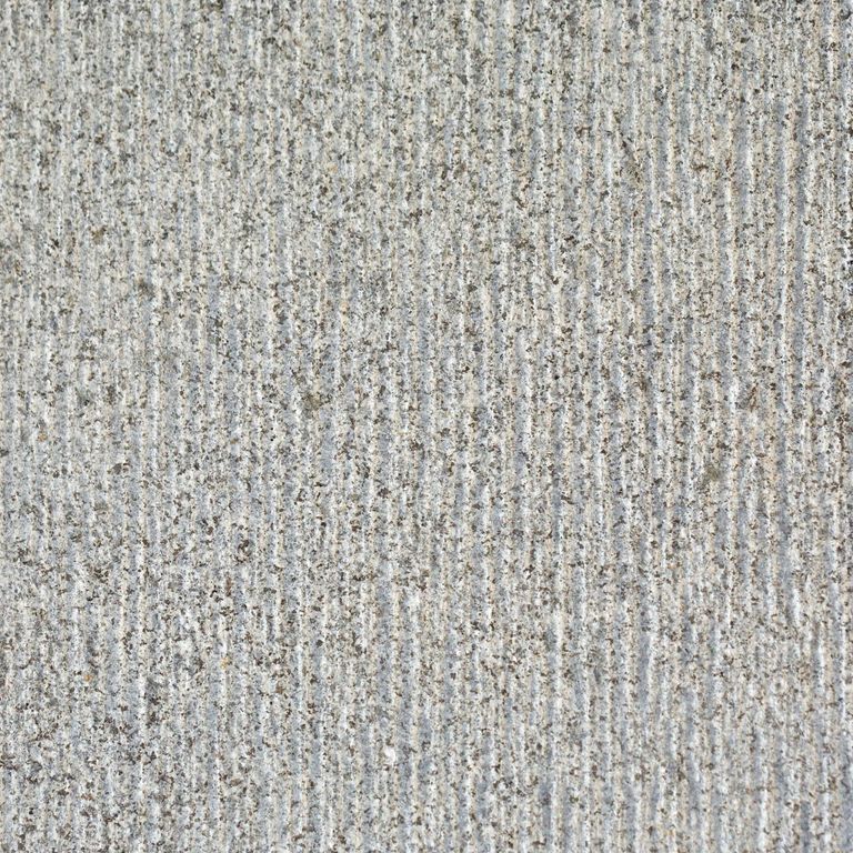 Feature image for Zen Gray Granite. The dominant color shown is gray; with beige, white and cream secondaries. Speckled and linear color patterns.