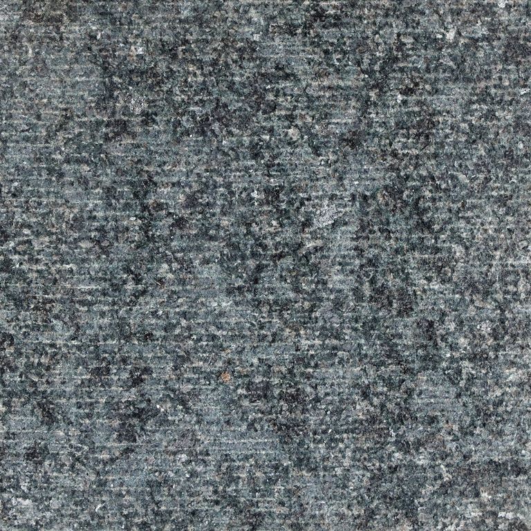 Color/Finish variation image for New Zen Black Granite. The surface finish shown is fine adze. Dominant colors shown are black and gray. The color mix creates a cool feeling. Coarse speckled color pattern. Contains some mica.