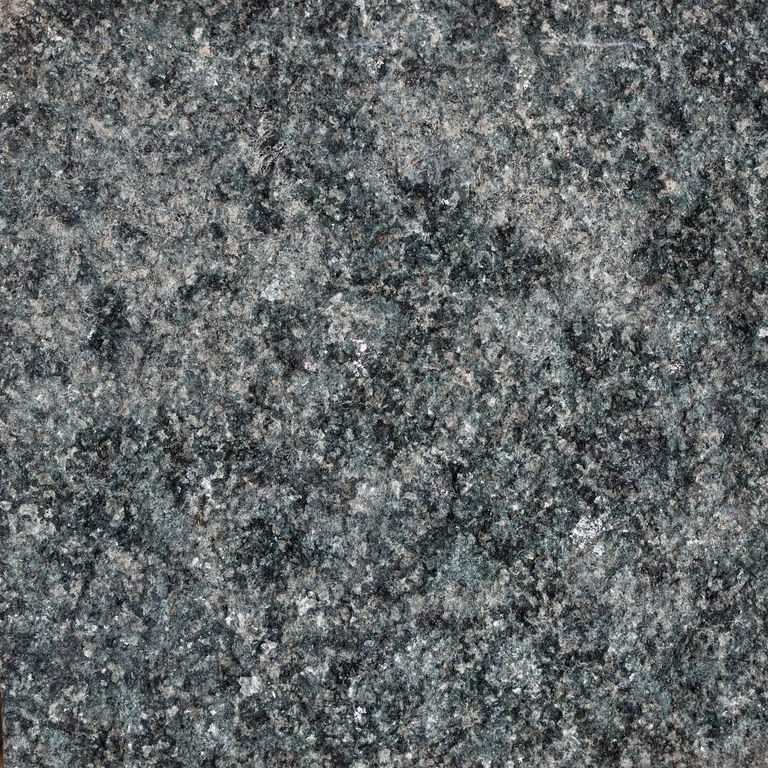 Color/Finish variation image for Granite - New Zen Black. The surface finish shown is bush hammered. Dominant colors shown are black and gray. The color mix creates a cool feeling. Coarse speckled color pattern. Contains some mica.