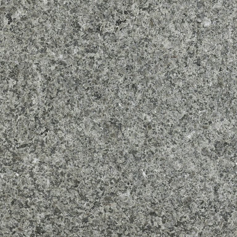Close-up image for New Zen Black Granite. The surface finishes shown are flamed and waterjet. The dominant color shown is gray; with brown, green and white secondaries. The color mix creates a cool feeling. Speckled color pattern. Contains some mica and mineral inclusions.