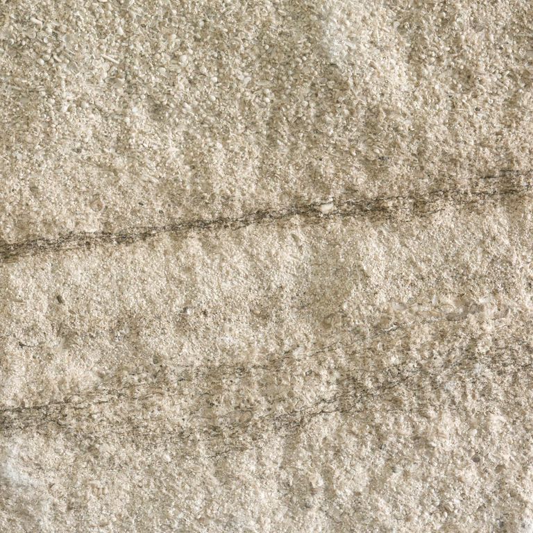 Color/Finish variation image for Silver Shadow Limestone. The surface finish shown is split-face. Dominant colors shown are beige and tan; with brown, gray, orange/rust and cream secondaries. Exhibits 