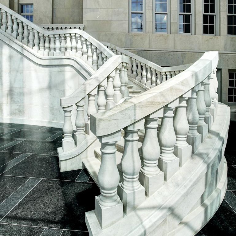 Application image for Silver Shadow Limestone. The image shows this material being used for landings and treads. This is a building stone for indoor and outdoor commercial and residential applications. Suitable for general use, low heat absorption surfaces, low slipperiness surfaces and high heel compatibilty situations. Relatively higher in price. This image has a Honed surface finish.