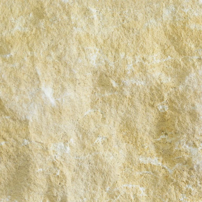 Color/Finish variation image for Limestone - Northern Buff. The surface finish shown is split-face. Dominant colors shown are beige, yellow and tan; with orange/rust and cream secondaries. Exhibits 