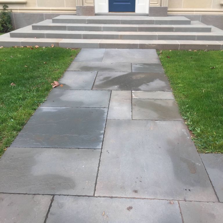 Application image for Bluestone - Blue/Gray - Natural Cleft Surface. The image shows this material being used in a path pavers application.