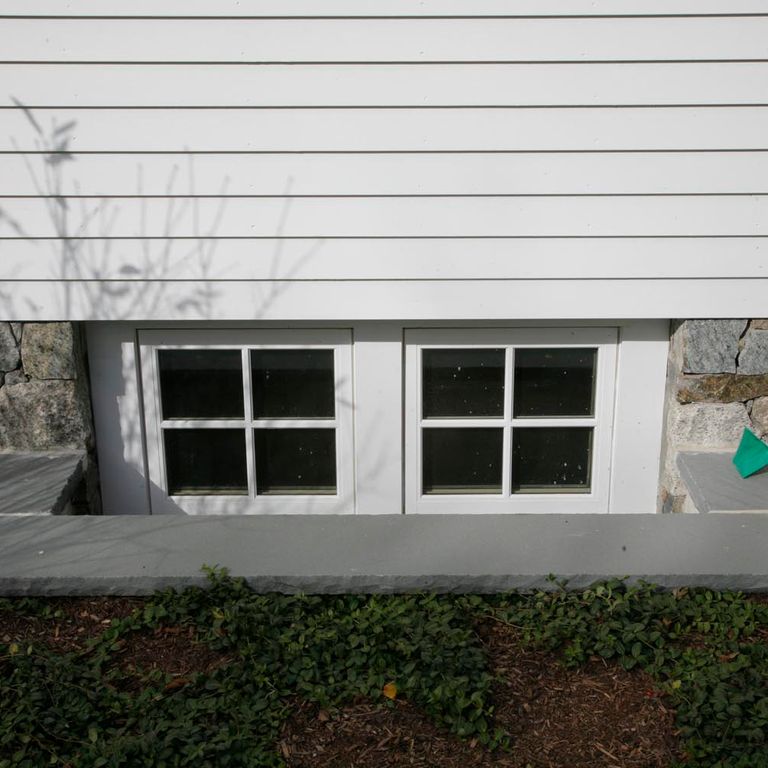 Application image for Bluestone - Blue/Gray - Flamed Finish. The image shows this material being used in a window well application.