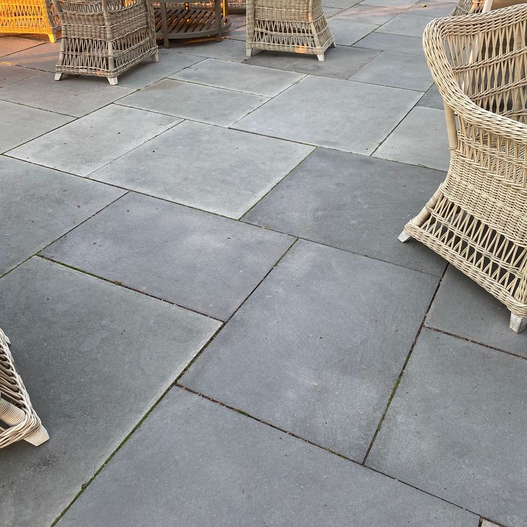 Application image for Bluestone - Blue/Gray - Flamed Finish. The image shows this material being used in a patio pavers application.