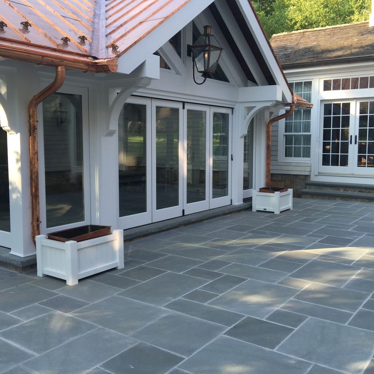 Application image for Bluestone - Blue/Gray - Flamed Finish. The image shows this material being used in a patio pavers application.