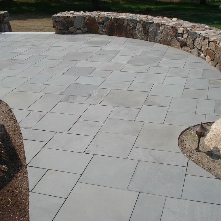 Application image for Bluestone - Blue/Gray - Flamed Finish. The image shows this material being used in a patio pavers application.