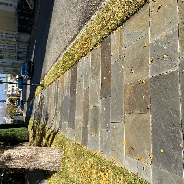 Application image for Full Color Mix Bluestone - Natural Cleft. The image shows this material being used in a path pavers application. The surface finish shown is natural cleft. Dominant colors shown are beige, brown, orange/rust and tan. The color mix creates a warm feeling.