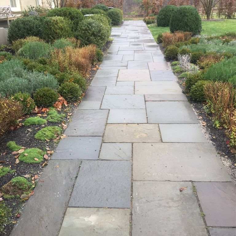 The image shows this material being used in a path pavers application.