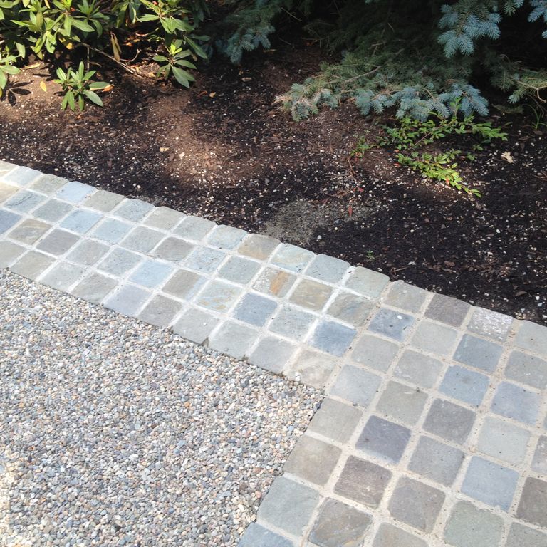 The image shows this material being used in a patio pavers application.