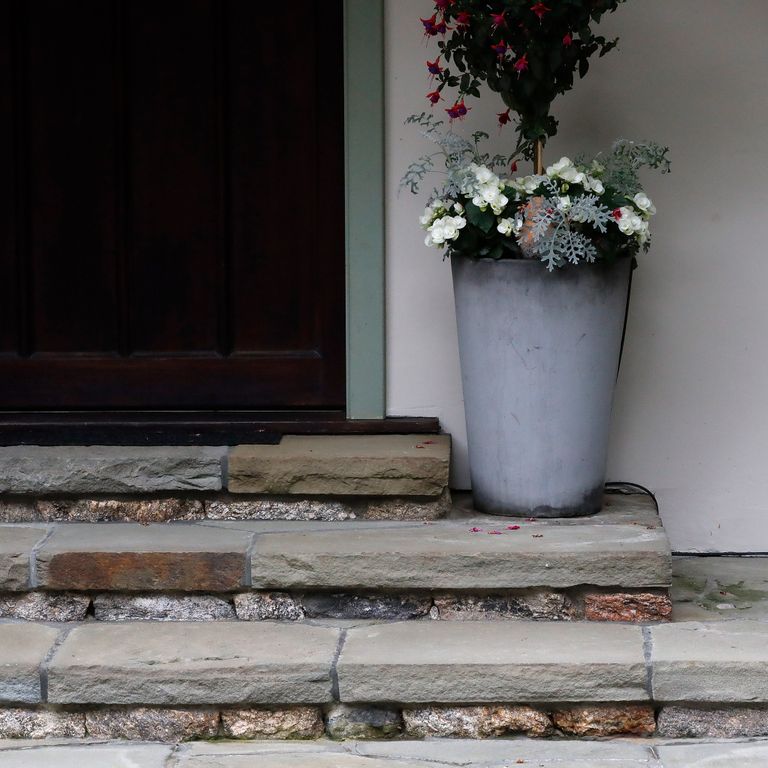 Application image for Bluestone Natural Cleft - Full Color Mix. The image shows this material being used in a treads application. The surface finish shown is natural cleft. Dominant colors shown are brown and gray; with a tan secondary.