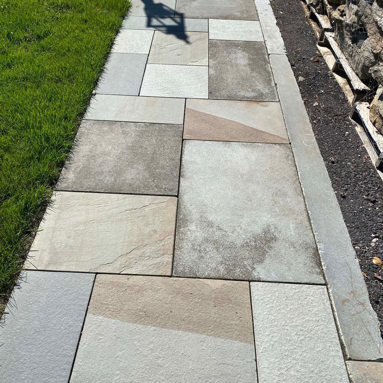 Application image for Bluestone - Full Color Mix. The image shows this material being used in a path pavers application.