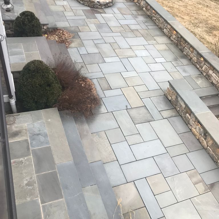The image shows this material being used for wallstone cap, patio pavers and treads.