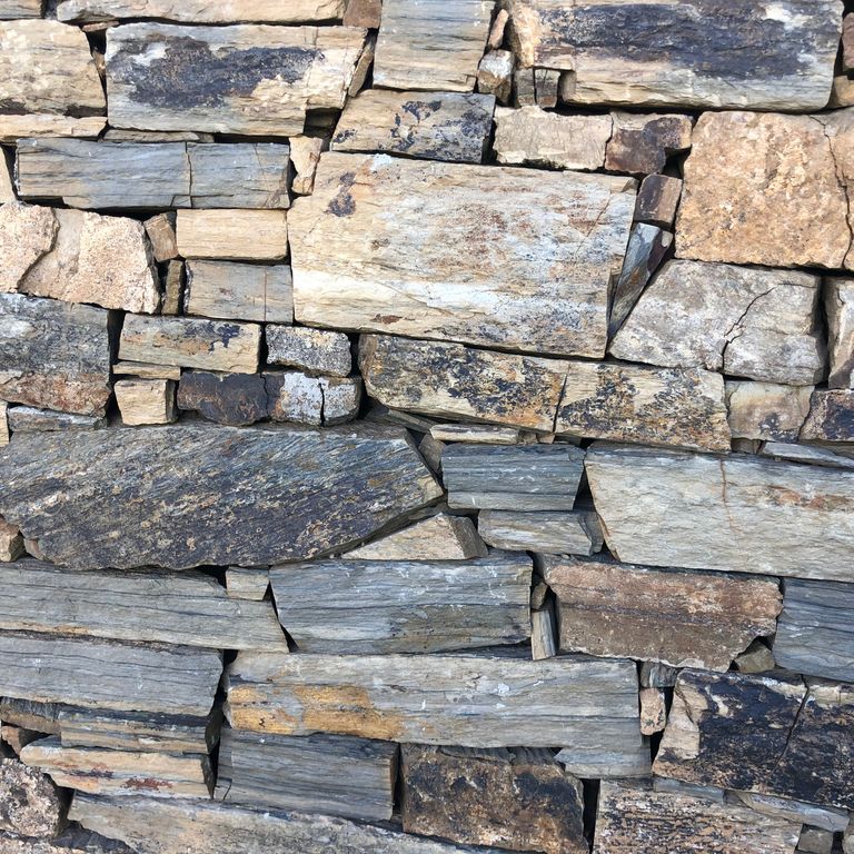Close-up image for Oxidized Shale. The surface finish shown is natural. The dominant color shown is gray; with beige, black, blue, brown, green, orange/rust, purple, white, tan and cream secondaries. Exhibits 