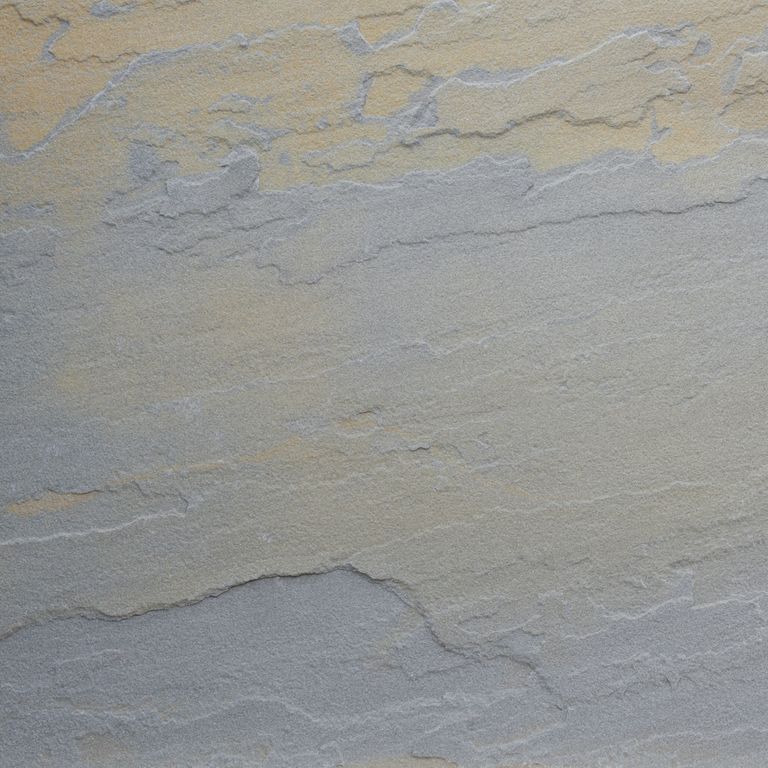 Color/Finish variation image for Bluestone Natural Cleft - Rust Tones. The dominant color shown is gray; with blue, brown, green, orange/rust and tan secondaries. Exhibits 