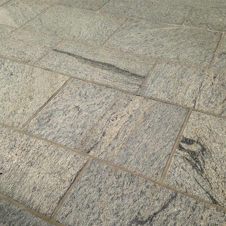 The image shows this material being used in a patio pavers application. Streaked color pattern.