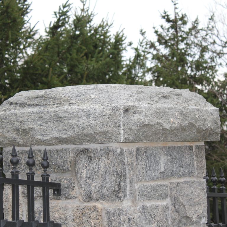 The image shows this material being used for posts and thin veneer. Streaked color pattern.