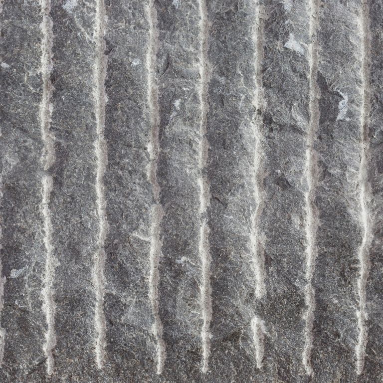 Color/Finish variation image for Highland Limestone. The surface finish shown is point stalk. The dominant color shown is gray; with brown, green, purple and white secondaries. Exhibits 