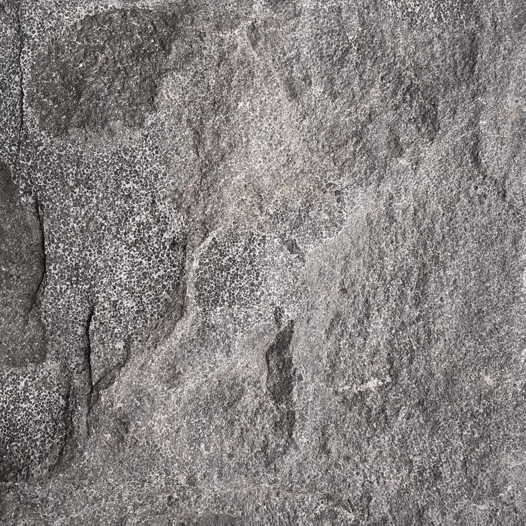 The surface finishes shown are acid washed and split-face. The dominant color shown is gray. The color mix creates a cool feeling. Coarse speckled and blotched color patterns.