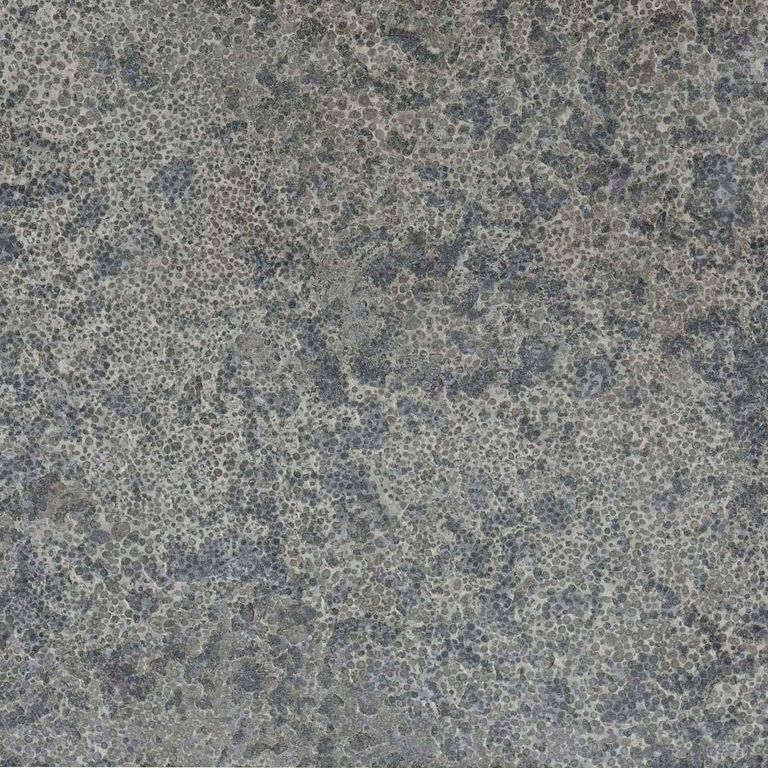 Color/Finish variation image for Highland Limestone. The surface finishes shown are brushed and flamed. The dominant color shown is gray; with brown, green and purple secondaries. Exhibits 