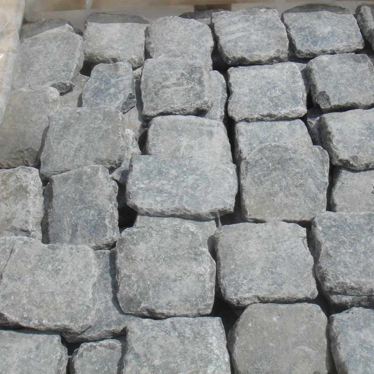 Application image for Reclaimed Belgian Bluestone Cobblestones. The surface finish shown is . The dominant color shown is gray. The color mix creates a cool feeling.
