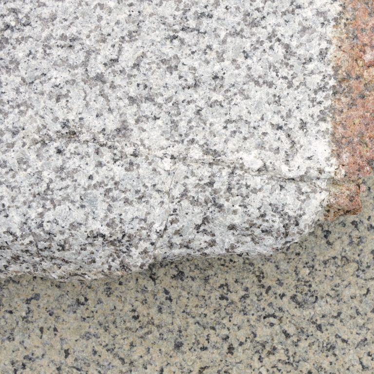 Color/Finish variation image for Reclaimed Rockport Granite. The dominant color shown is gray; with beige, orange/rust, pink, tan and cream secondaries. The color mix creates a warm feeling. Coarse speckled color pattern.