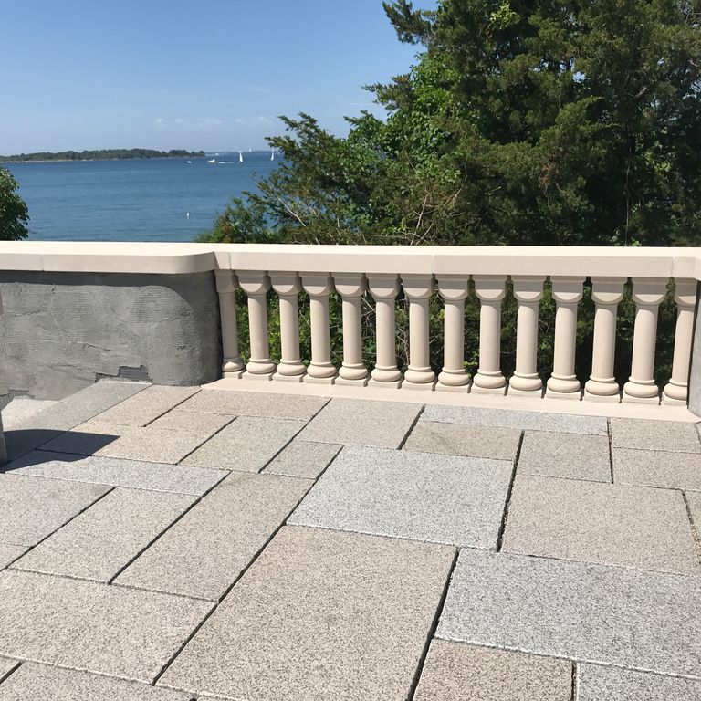 The image shows this material being used in a patio pavers application. Speckled and fine speckled color patterns.