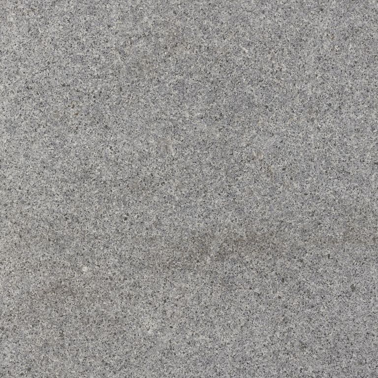 Feature image for Ash Granite. The dominant color shown is gray; with a beige secondary. The color mix creates a cool feeling. Fine speckled color pattern.