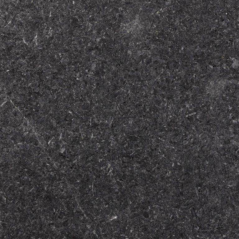 Color/Finish variation image for Granite - Cambrian Black. The surface finish shown is waterjet. The dominant color shown is black. The color mix creates a cool feeling. Blotched and coarse speckled color patterns. Contains some mica.