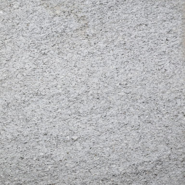Color/Finish variation image for Chelmsford Gray Granite. The surface finish shown is flamed. Dominant colors shown are gray and white. The color mix creates a cool feeling.