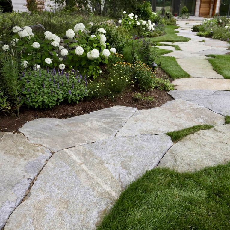 Feature image for Dodlin Hill Granite. The image shows this material being used in a path pavers application. The dominant color shown is gray; with pink, white and cream secondaries. Exhibits 