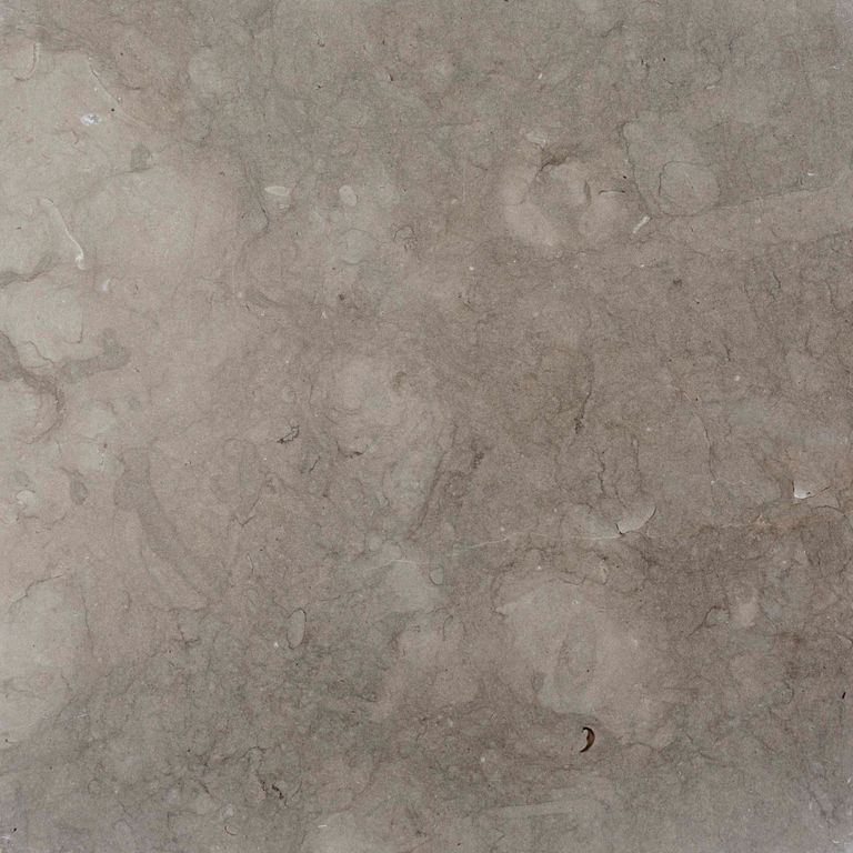 Color/Finish variation image for Limestone - Portuguese Dawn Haze. The surface finish shown is honed. Dominant colors shown are green, gray and purple. Exhibits 