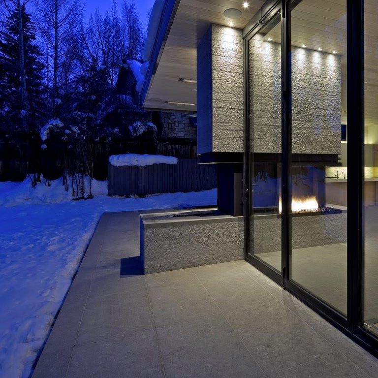 Feature image for Dawn Haze Limestone. The image shows this material being used for interior floor, patio pavers and thin veneer. Dominant colors shown are beige, gray and tan. The color mix creates a cool feeling. Solid and cloudy color patterns. Contains mineral inclusions.