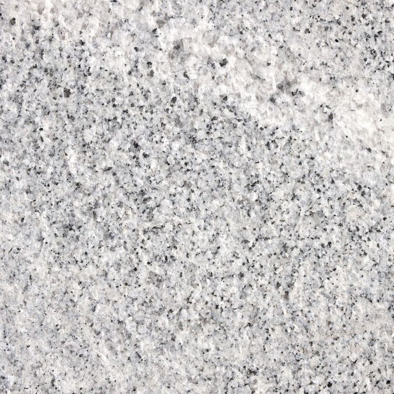 Color/Finish variation image for Granite - Kitledge. The surface finish shown is flamed. Dominant colors shown are gray and white; with beige, pink and cream secondaries. Exhibits 