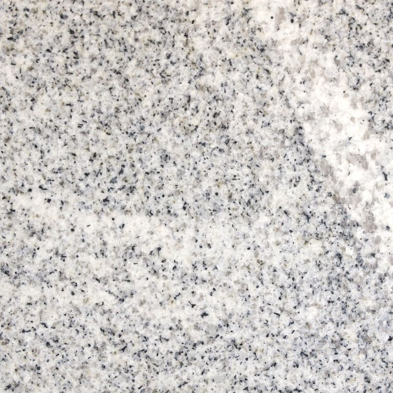 Color/Finish variation image for Kitledge Gray Granite. The surface finish shown is honed. The dominant color shown is gray; with beige, pink, white and cream secondaries. Exhibits 