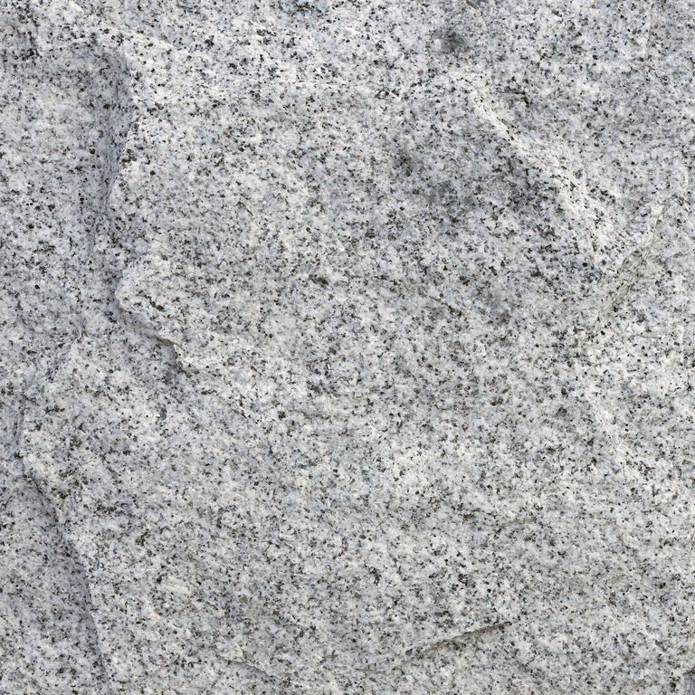 The surface finish shown is rockfaced. Dominant colors shown are gray and white. The color mix creates a cool feeling. Coarse speckled color pattern.