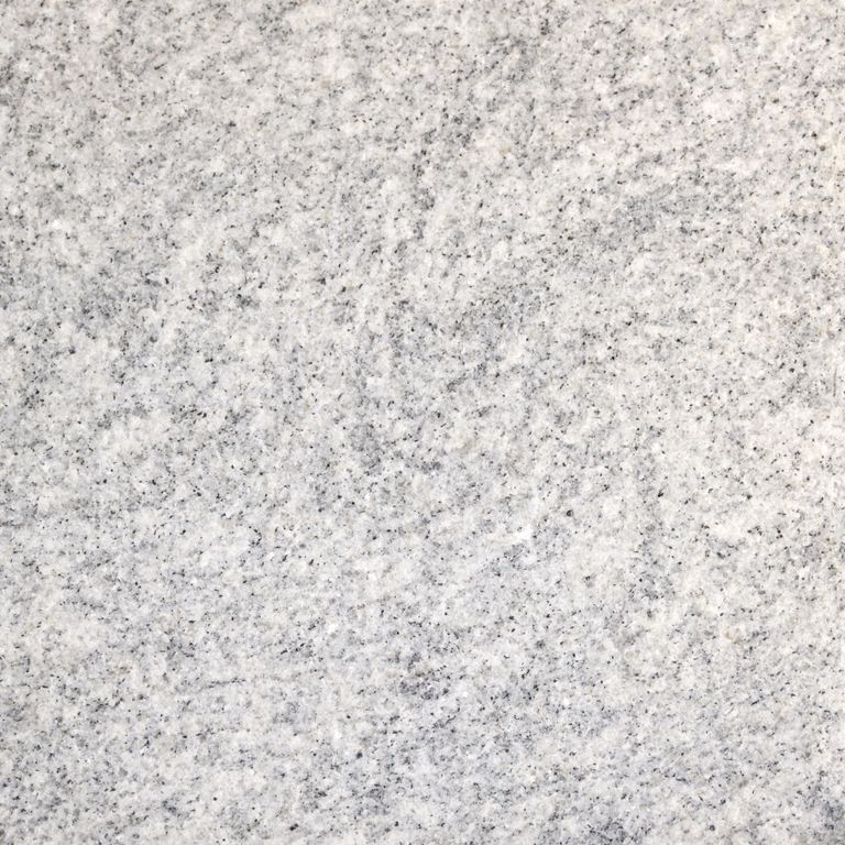 Color/Finish variation image for Silver Cloud Granite. The surface finish shown is flamed. Dominant colors shown are gray and white; with beige, pink and cream secondaries. The color mix creates a cool feeling. Speckled and cloudy color patterns.