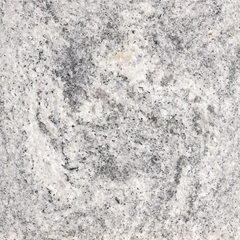 Color/Finish variation image for Tapestry Granite. The surface finish shown is flamed. The dominant color shown is gray; with beige, pink, white and cream secondaries. Exhibits 