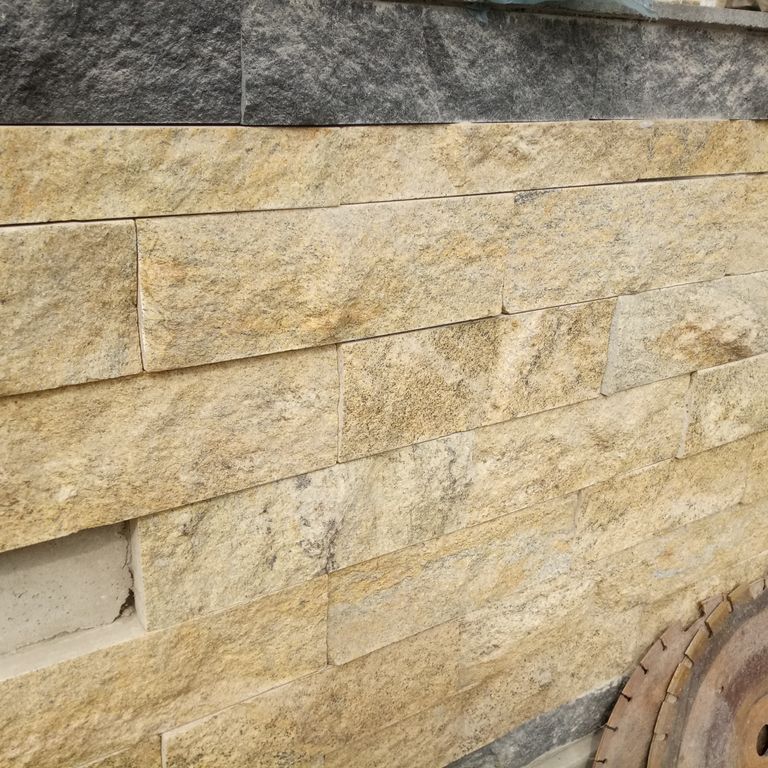 Application image for Granite - Wheat. The image shows this material being used in a thin veneer application. The surface finish shown is split-face. The dominant color shown is tan. The color mix creates a warm feeling.